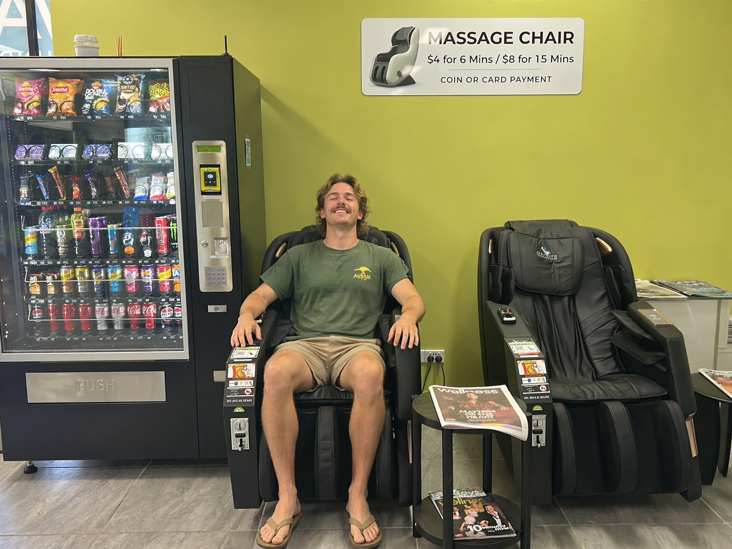 Customer relaxing in massage chair at WashSpot